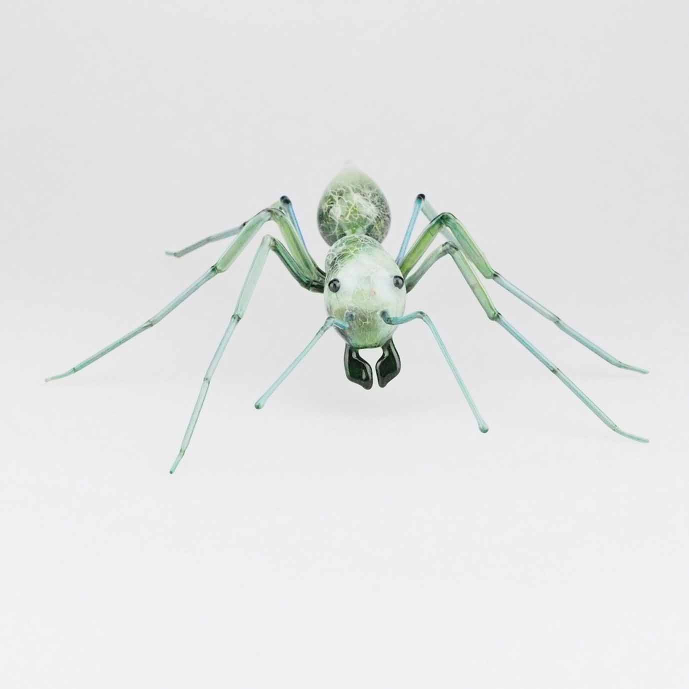 glassblowing green glass ant sculpture